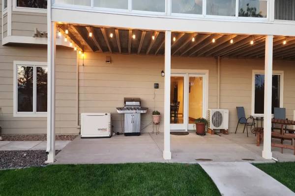 Covered patio with string lights at dusk