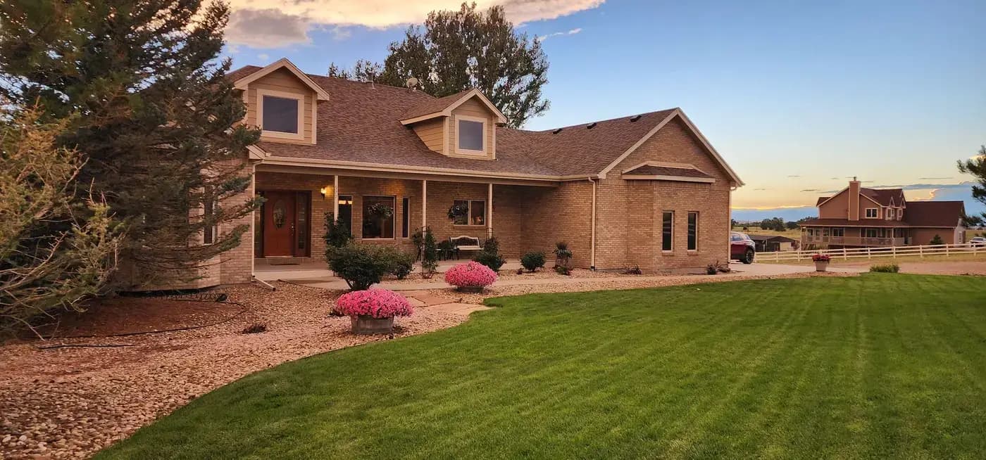 Denver Mennonite Guest Home exterior at golden hour showing nonprofit guest accommodation near Denver hospitals