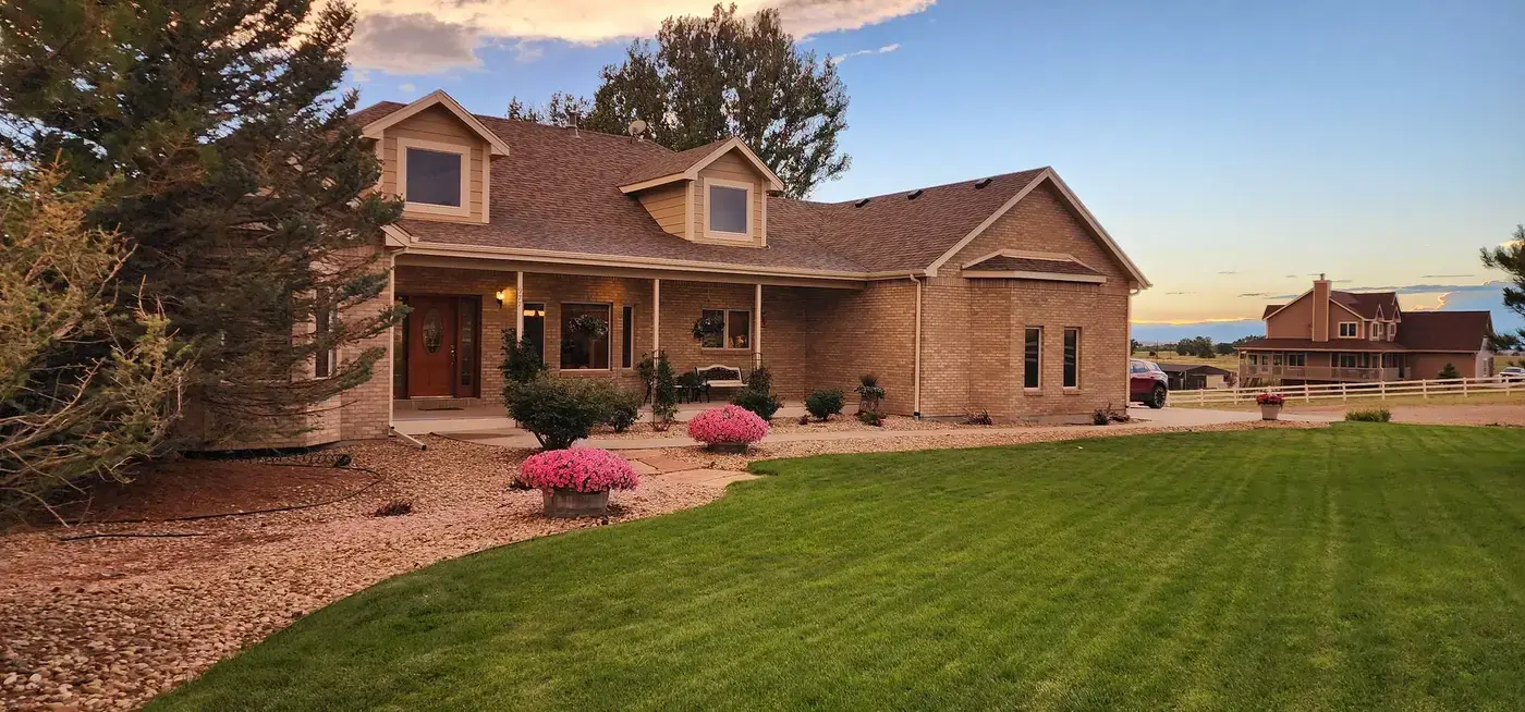 Denver Mennonite Guest Home exterior at golden hour showing nonprofit guest accommodation near Denver hospitals