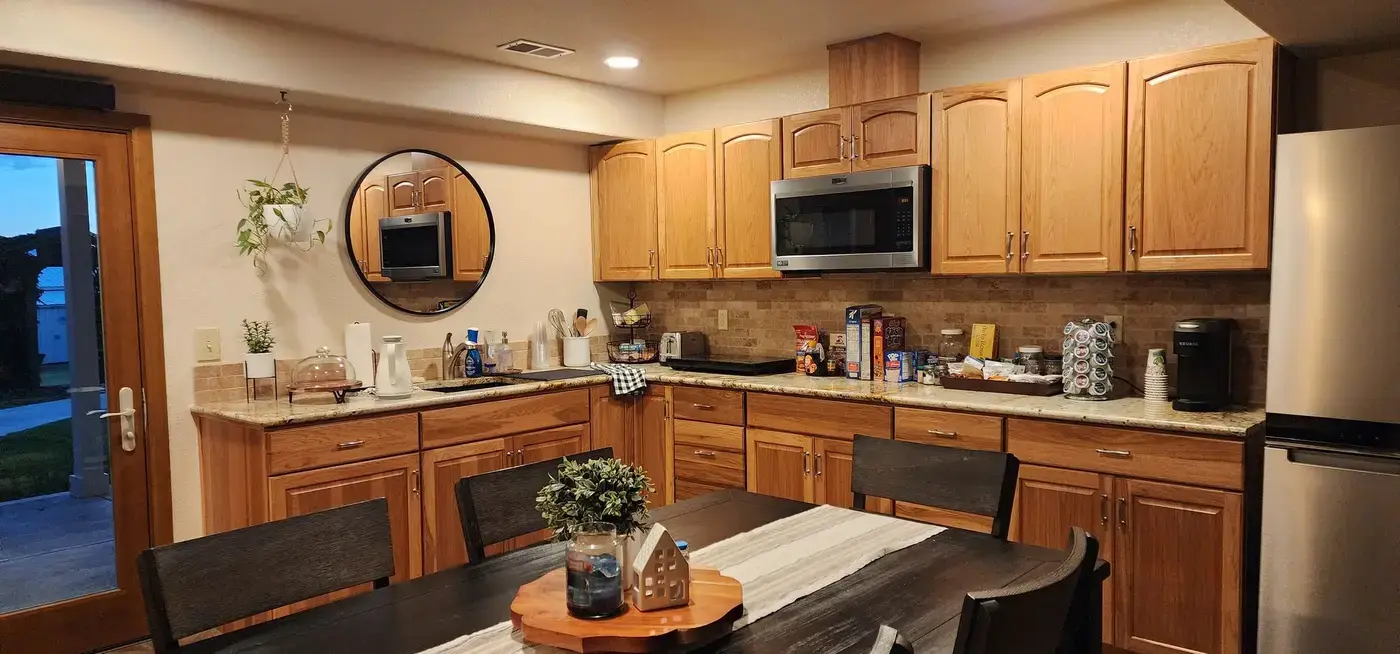 Denver Guest House kitchen with wood cabinetry available to guest families